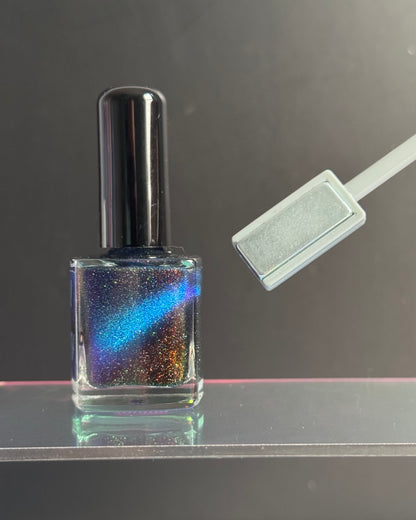 Rectangle end of magnetic wand pulls magnetic pigments into a line.